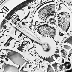 black and white close view of watch mechanism